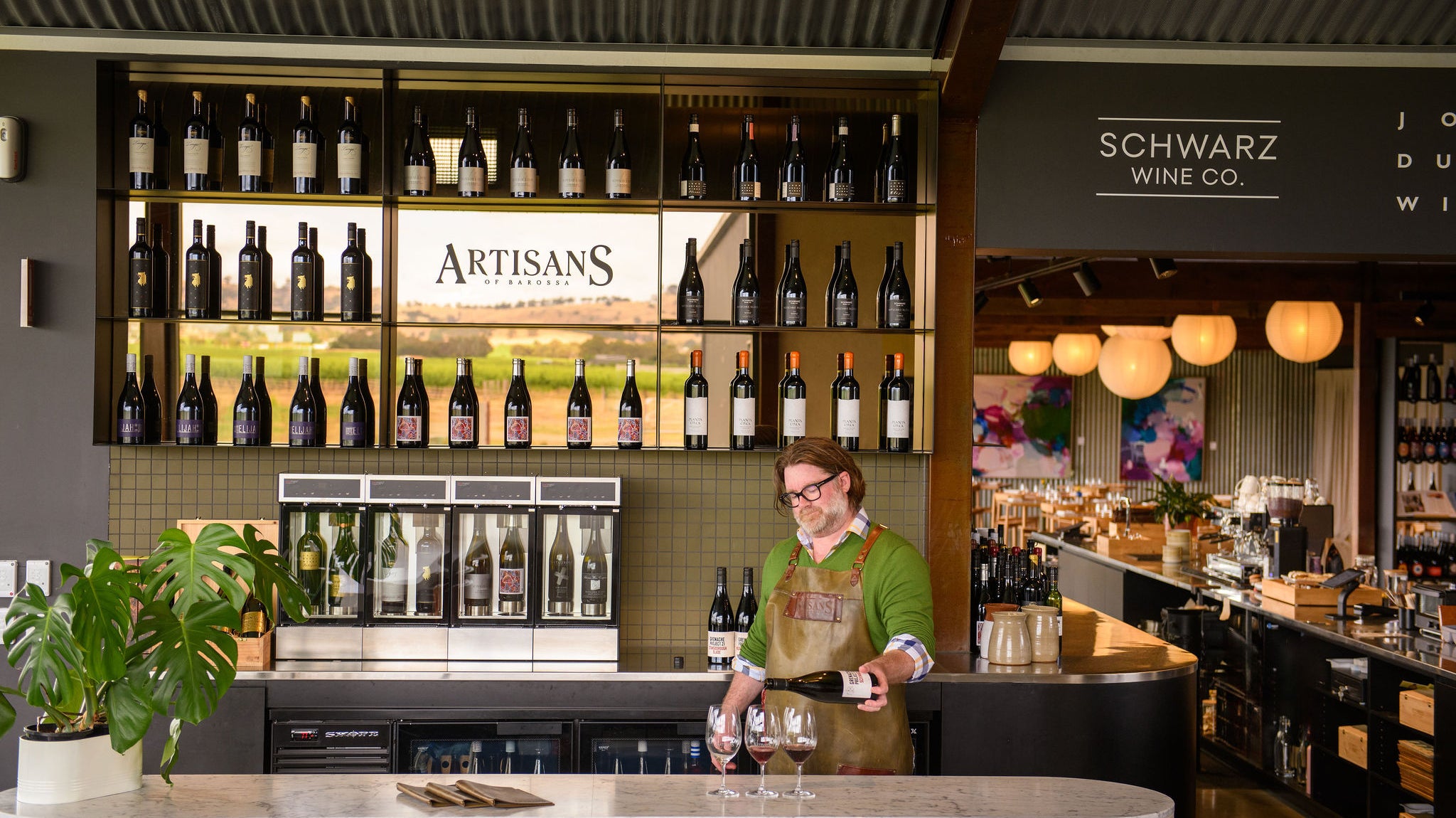 Fraser Mackenzie pouring the Grenache Project in Artisans of Barossa's Wine Room