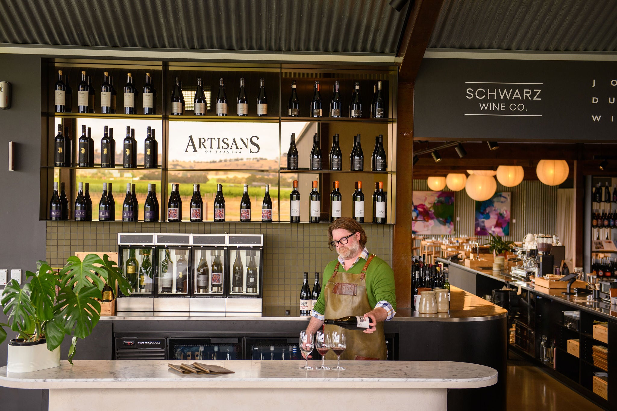 Fraser Mackenzie pouring the Grenache Project in Artisans of Barossa's Wine Room